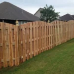 196 feet of 6 foot board to board arch top wood fence with decorative post caps