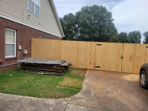 Overlapping pickets on a 6 foot board to board privacy fence