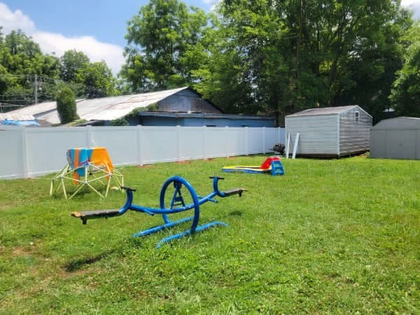 460 feet of 6 foot white vinyl privacy fence around a family back yard